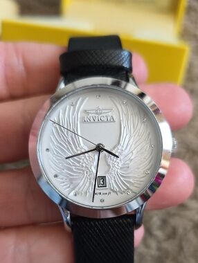 Invicta Womens ANGEL White Dial Wing-Relief Watch with Black Strap